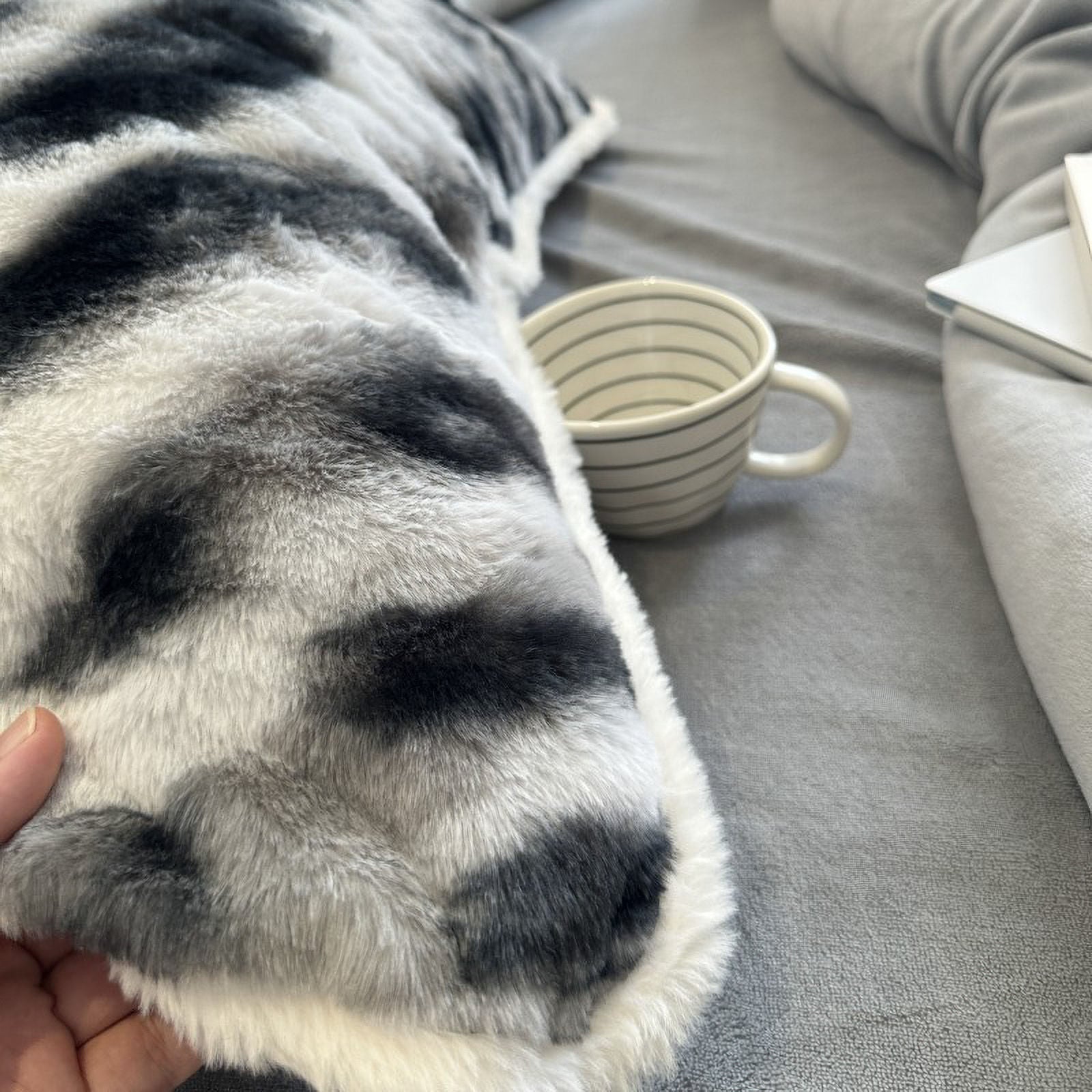 Hand touching the soft shaggy fleece duvet cover surface - RoomDen