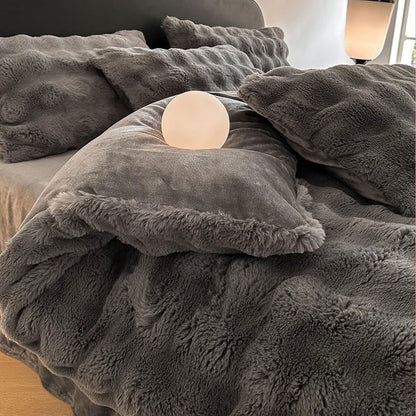 Cozy gray plush bedding with smooth pillow and warm lighting – RoomDen