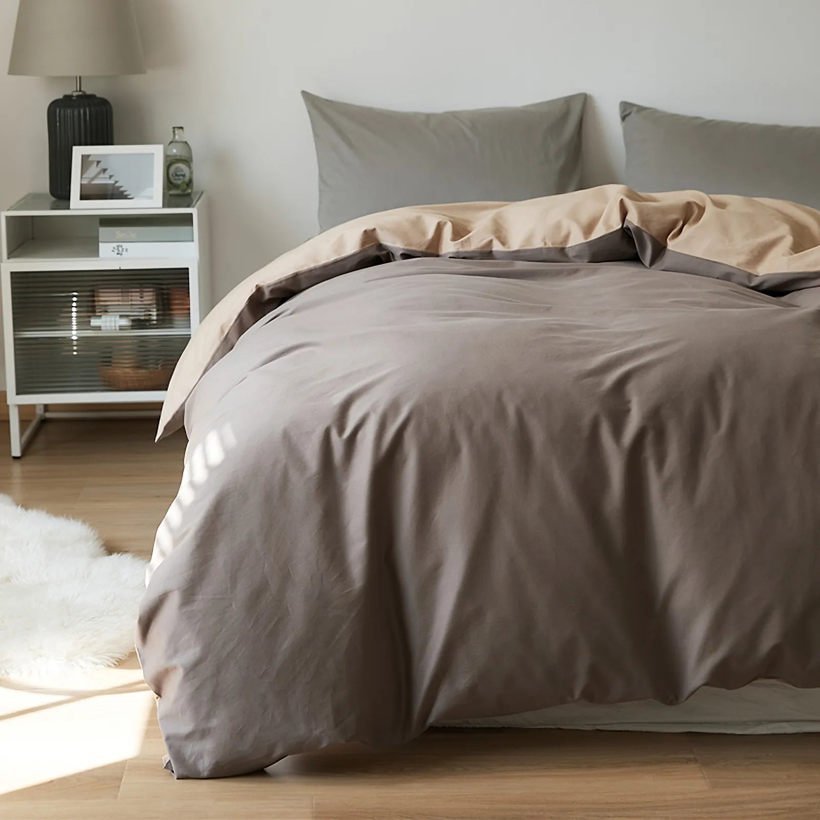 Soft neutral two-tone washed cotton duvet cover with a minimalist solid design on a cozy modern bed – RoomDen