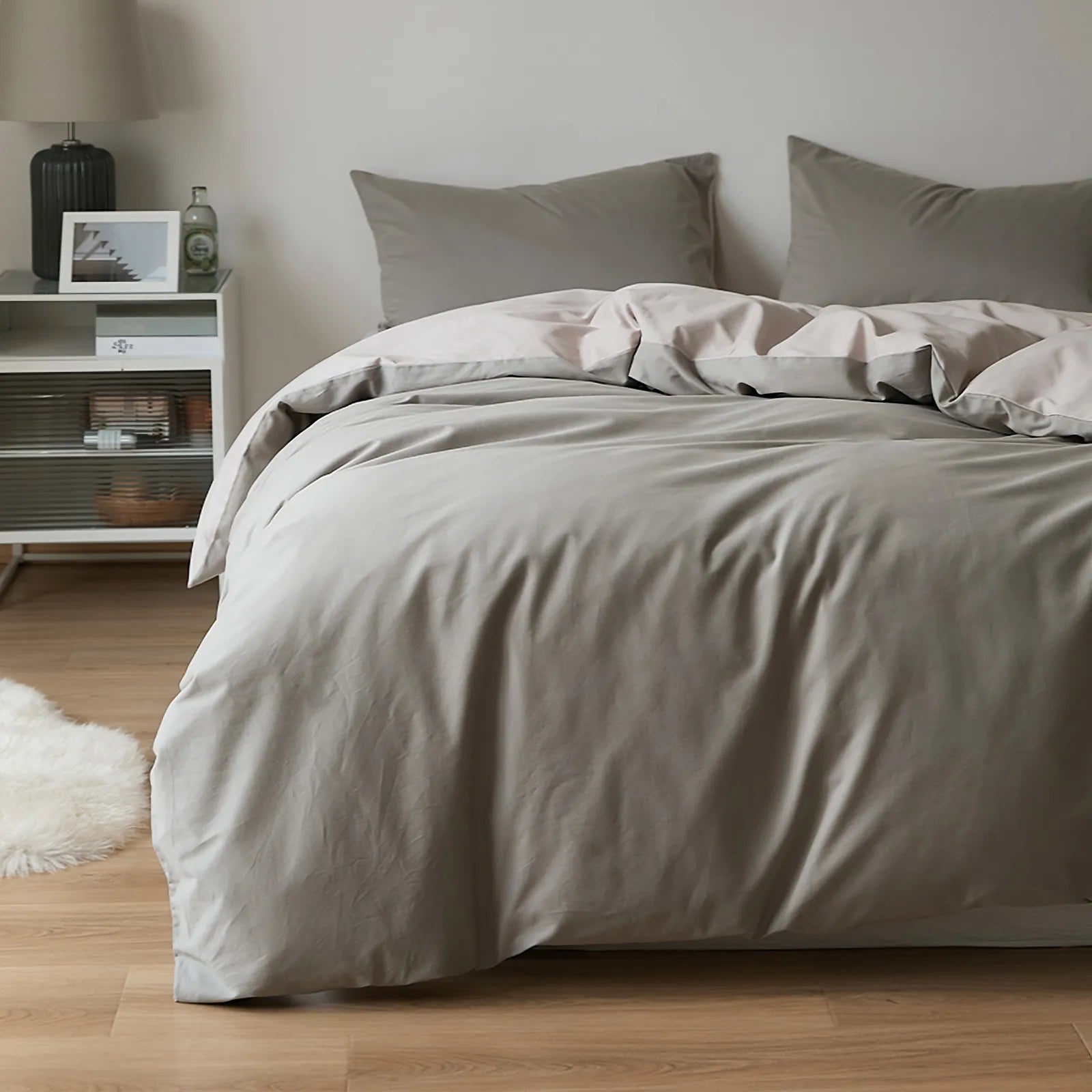 Soft neutral two-tone washed cotton duvet cover with a minimalist solid design on a cozy modern bed – RoomDen