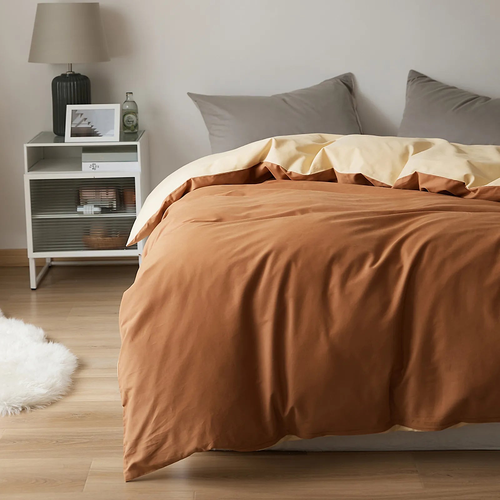 Soft neutral two-tone washed cotton duvet cover with a minimalist solid design on a cozy modern bed – RoomDen