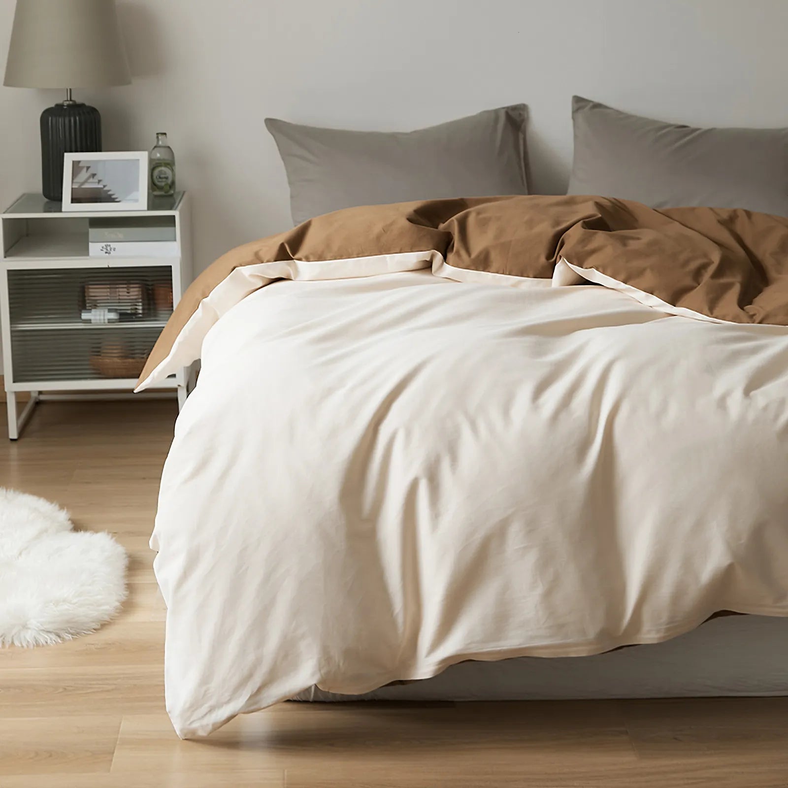 Soft neutral two-tone washed cotton duvet cover with a minimalist solid design on a cozy modern bed – RoomDen