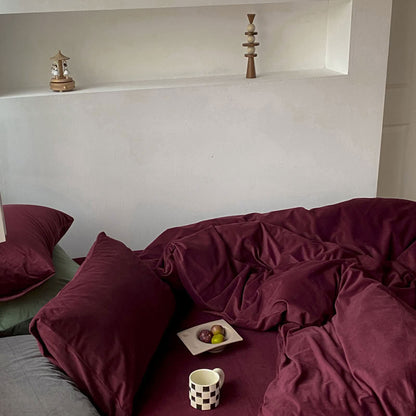 Solid Wine Red velvet bedding set with soft plush texture and minimalist cozy bedroom scene - RoomDen