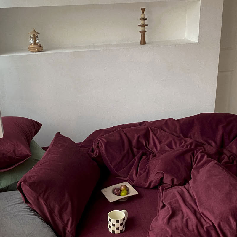 Solid Wine Red velvet bedding set with soft plush texture and minimalist cozy bedroom scene - RoomDen