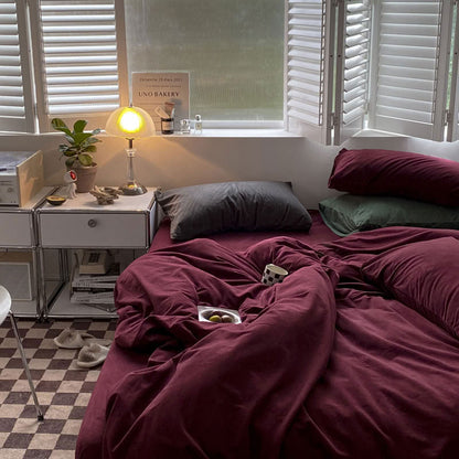 Solid Wine Red velvet bedding set with soft plush texture and minimalist cozy bedroom scene - RoomDen
