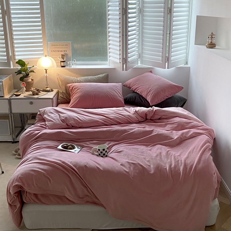 Solid Rose Pink velvet bedding set with soft plush texture and minimalist cozy bedroom scene - RoomDen