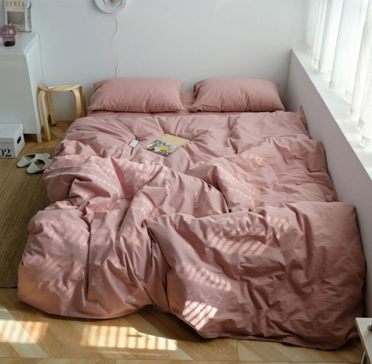 Warm blush pink washed cotton bedding set creating a relaxing and gentle home atmosphere - RoomDen