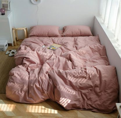 Warm blush pink washed cotton bedding set creating a relaxing and gentle home atmosphere - RoomDen