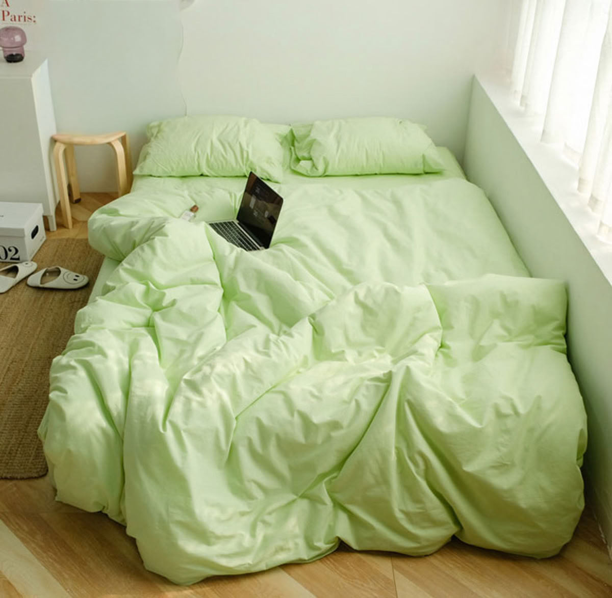 Soft apple green washed cotton bedding set creating a refreshing and calming atmosphere - RoomDen