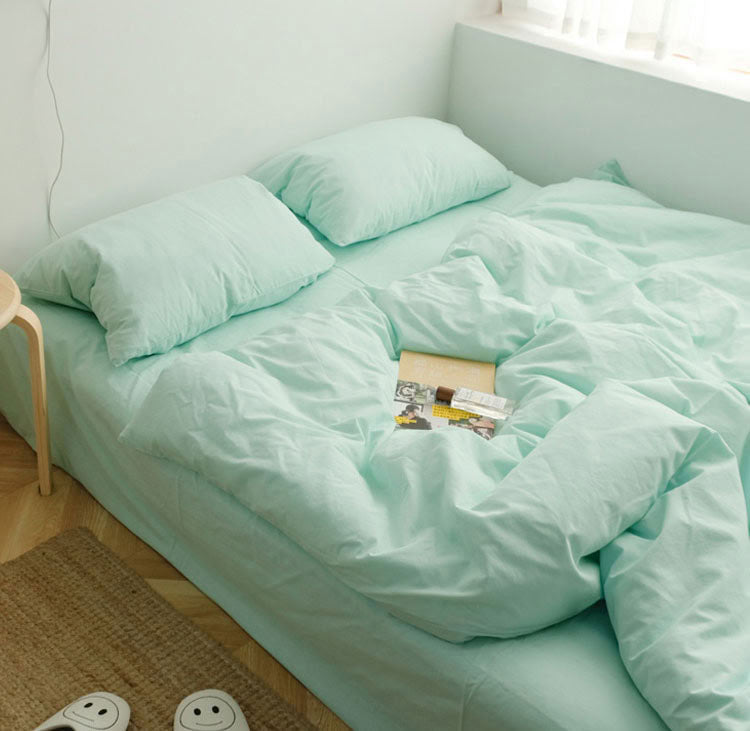 Mint Green washed cotton bedding set with pillows and a cozy minimalist setup - RoomDen