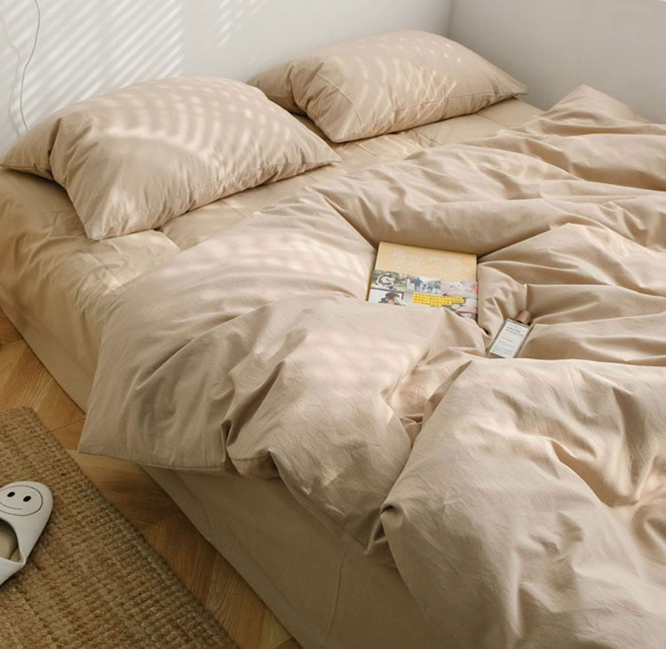 Khaki Beige washed cotton bedding set with pillows and a cozy minimalist setup - RoomDen