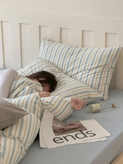 Cozy washed cotton bedding in blue and white stripe pattern with soft texture – RoomDen