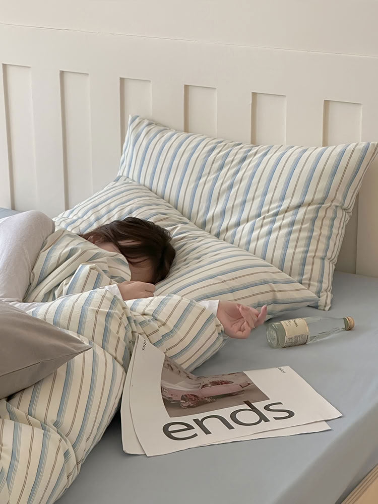 Cozy washed cotton bedding in blue and white stripe pattern with soft texture – RoomDen