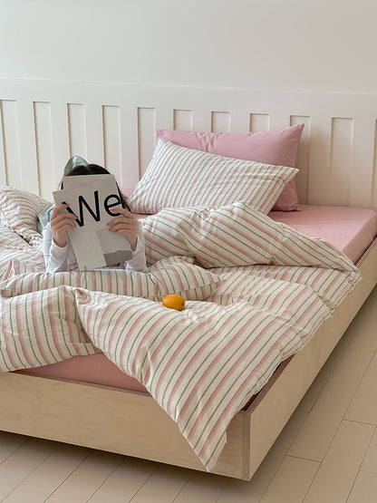 Blush pink striped cotton bedding set creating a warm minimalist bedroom look – RoomDen
