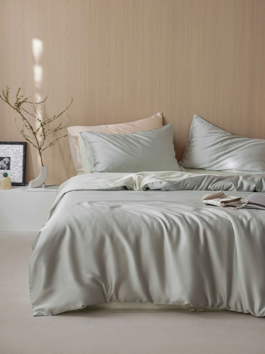 Soft mint green Cooling Tencel bedding set styled in minimalist bedroom with warm wood wall – RoomDen