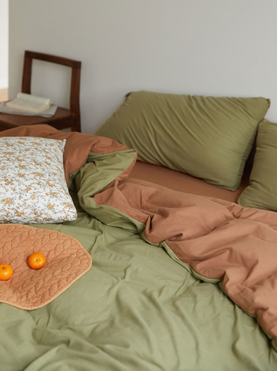 Soft stretchy jersey cotton bedding in olive and terracotta tones - RoomDen