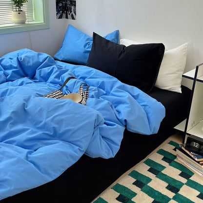 Blue and black contrast bedding in modern minimalist bedroom – RoomDen
