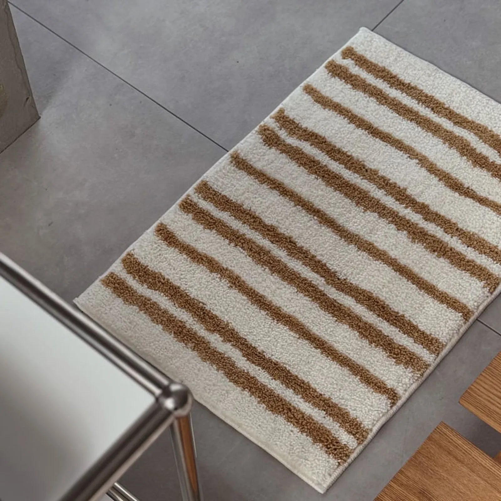 Angled view of the caramel striped accent rug showcasing its soft texture - RoomDen