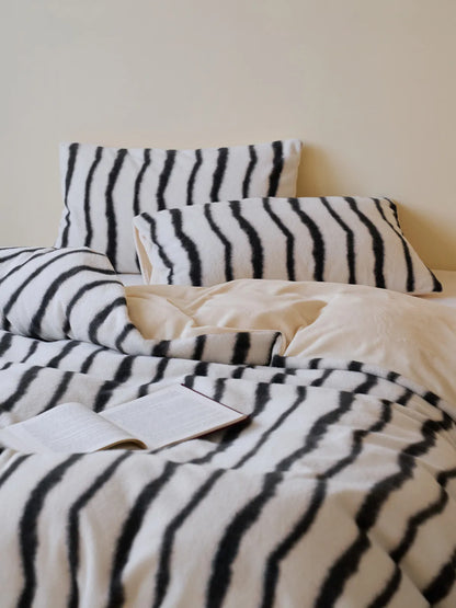 Close up of black and white wavy striped fleece fabric texture RoomDen.