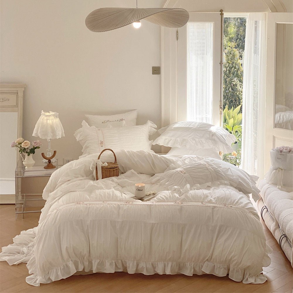Winnifred Ruffled Washed Cotton Bedding Set – full white ruffled bed beneath a ceiling fan - Roomden