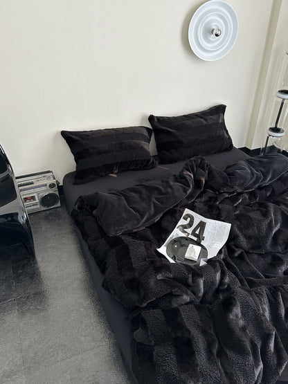 Black plush fleece bedding set with bold wide stripes creating a cozy and stylish modern bedroom look - RoomDen